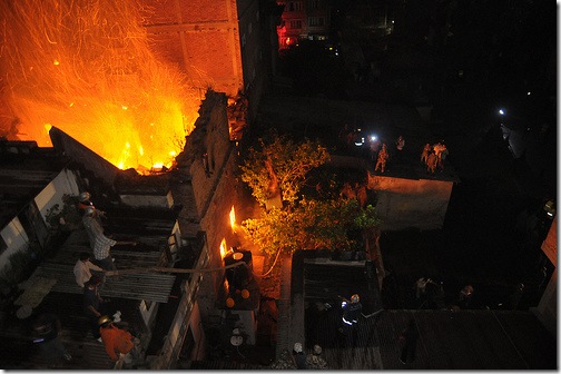 Fire fighters and local douse fire at a house of Nardevi on Friday, April 16, 2010. Photo: Bijay Rai/ Nagarik/ Republica/ 
