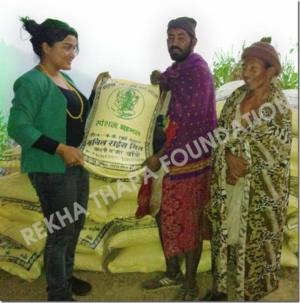 rekha distributes rice to Raute people